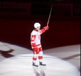 Dominik Shine of the Grand Rapids Griffins skates out during player introductions before the team's home opener against the Manitoba Moose.