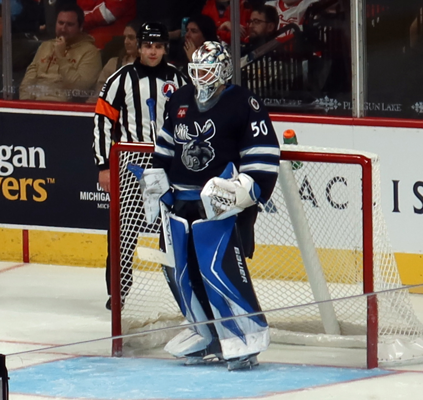 Domenic DiVincentiis of the Manitoba Moose stands in his crease during a stop in play in a game against the Grand Rapids Griffins.