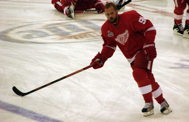 Tomas Holmstrom looks for a pass as he crosses the blue line during pre-game warmups.