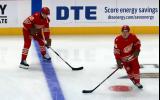 Emmitt Finnie and Axel Sandin-Pellikka of the Detroit Red Wings skate at the blue line during pre-game warmups before a game against the Montreal Canadiens.