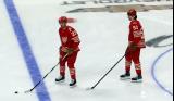 Mason Appleton and Moritz Seider of the Detroit Red Wings skate in the neutral zone during pre-game warmups before a game against the Montreal Canadiens.