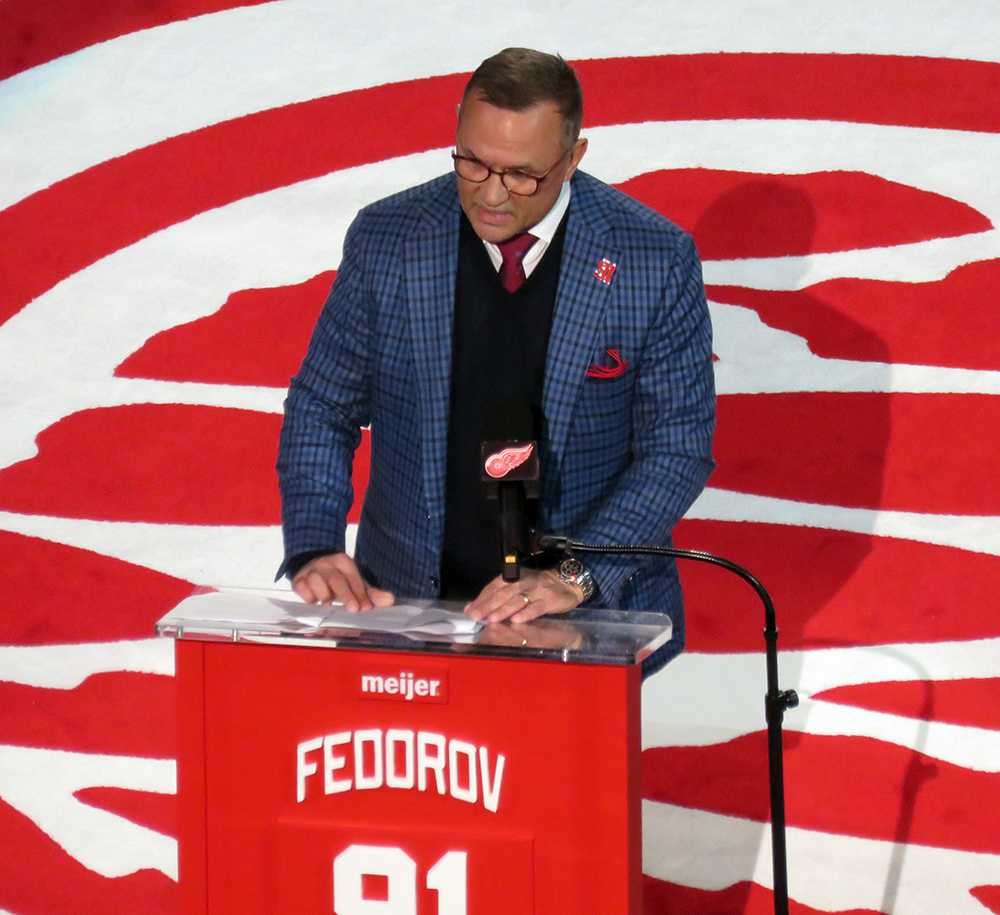 Steve Yzerman stands at the podium to speak during Sergei Fedorov's jersey retirement ceremony.