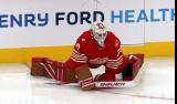 Cam Talbot of the Detroit Red Wings stretches near the boards during pre-game warmups before a game against the Montreal Canadiens.