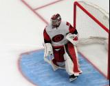 Frederik Andersen of the Carolina Hurricanes stretches in his crease at the start of the second period of a game against the Detroit Red Wings.