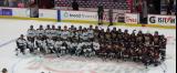 The New York Sirens and Montreal Victoire pose at center ice for a group photo after the PWHL Takeover Tour Detroit game.
