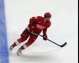 Michael Rasmussen of the Detroit Red Wings skates during pre-game warmups before a game against the Carolina Hurricanes, wearing a customized Sergei Fedorov jersey and white skates in honor of Fedorov's jersey retirement.