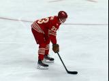 Lucas Raymond of the Detroit Red Wings gets set for a faceoff during a game against the Montreal Canadiens.