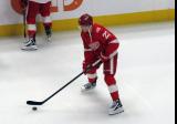 Lucas Raymond of the Detroit Red Wings skates during pre-game warmups before a game against the Carolina Hurricanes, wearing a customized Sergei Fedorov jersey and white skates in honor of Fedorov's jersey retirement.