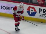 Alexander Nikishin of the Carolina Hurricanes stands at the bench during pre-game warmups before a game against the Detroit Red Wings.
