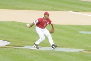 Chris Chelios winds up to deliver a pitch during the 2006 Champions Challenge charity softball game.