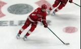 Marco Kasper of the Detroit Red Wings skates in the neutral zone during pre-game warmups before a game against the Carolina Hurricanes, wearing a customized Sergei Fedorov jersey and white skates in honor of Fedorov's jersey retirement.