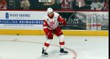Eduards Tralmaks of the Grand Rapids Griffins winds up for a shot during pre-game warmups before a game against the Manitoba Moose.