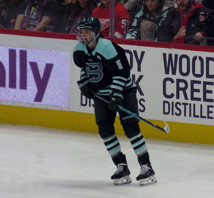 Megan Keller of the Boston Fleet skates near the boards during the PWHL Takeover Tour game against the Vancouver Goldeneyes.