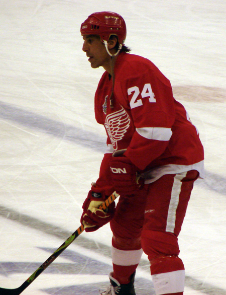 Chris Chelios stands inside the blue line waiting for the puck during pre-game warmups.