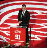 Sergei Fedorov stands at the podium during his jersey retirement ceremony.