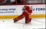 Cam Talbot of the Detroit Red Wings passes a puck while stretching during pre-game warmups before a game against the Montreal Canadiens.