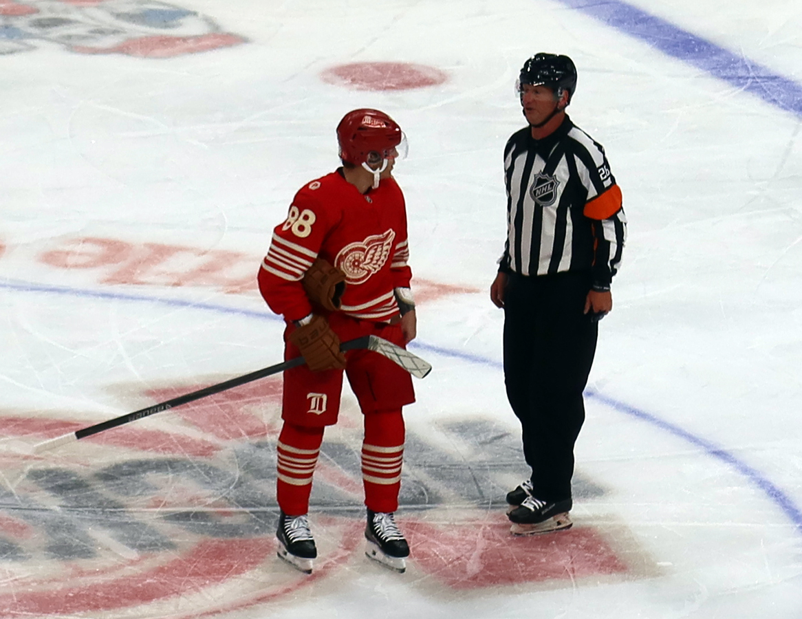 Patrick Kane of the Detroit Red Wings talks to referee Chris Lee during a stop in play in a game against the Montreal Canadiens.