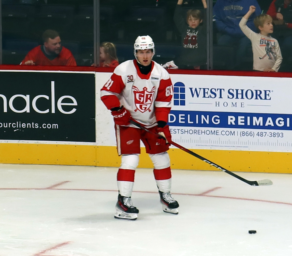 Jakub Rychlovsky of the Grand Rapids Griffins skates near the boards during pre-game warmups before a game against the Manitoba Moose.