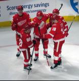 Jacob Bernard-Docker, Patrick Kane, Albert Johansson, Alex Debrincat and Andrew Copp of the Detroit Red Wings celebrate a goal by Johansson during a game against the Carolina Hurricanes.
