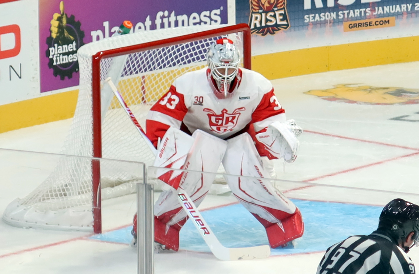 Sebastian Cossa of the Grand Rapids Griffins gets set in his crease during a game against the Manitoba Moose.