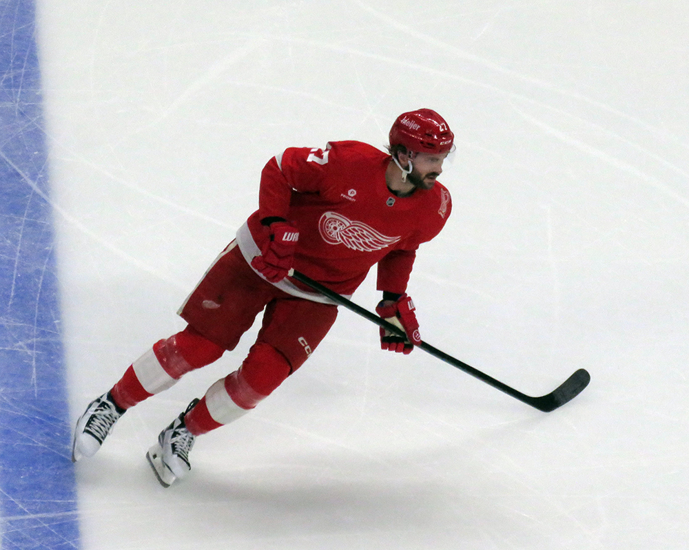 Michael Rasmussen of the Detroit Red Wings skates during pre-game warmups before a game against the Carolina Hurricanes, wearing a customized Sergei Fedorov jersey and white skates in honor of Fedorov's jersey retirement.