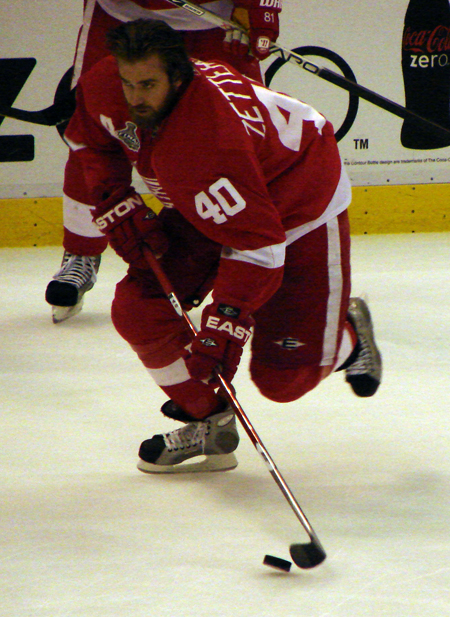 Henrik Zetterberg charges off the boards with the puck during pre-game warmups.
