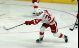 Eduards Tralmaks of the Grand Rapids Griffins fires a shot on goal during pre-game warmups before a game against the Manitoba Moose.