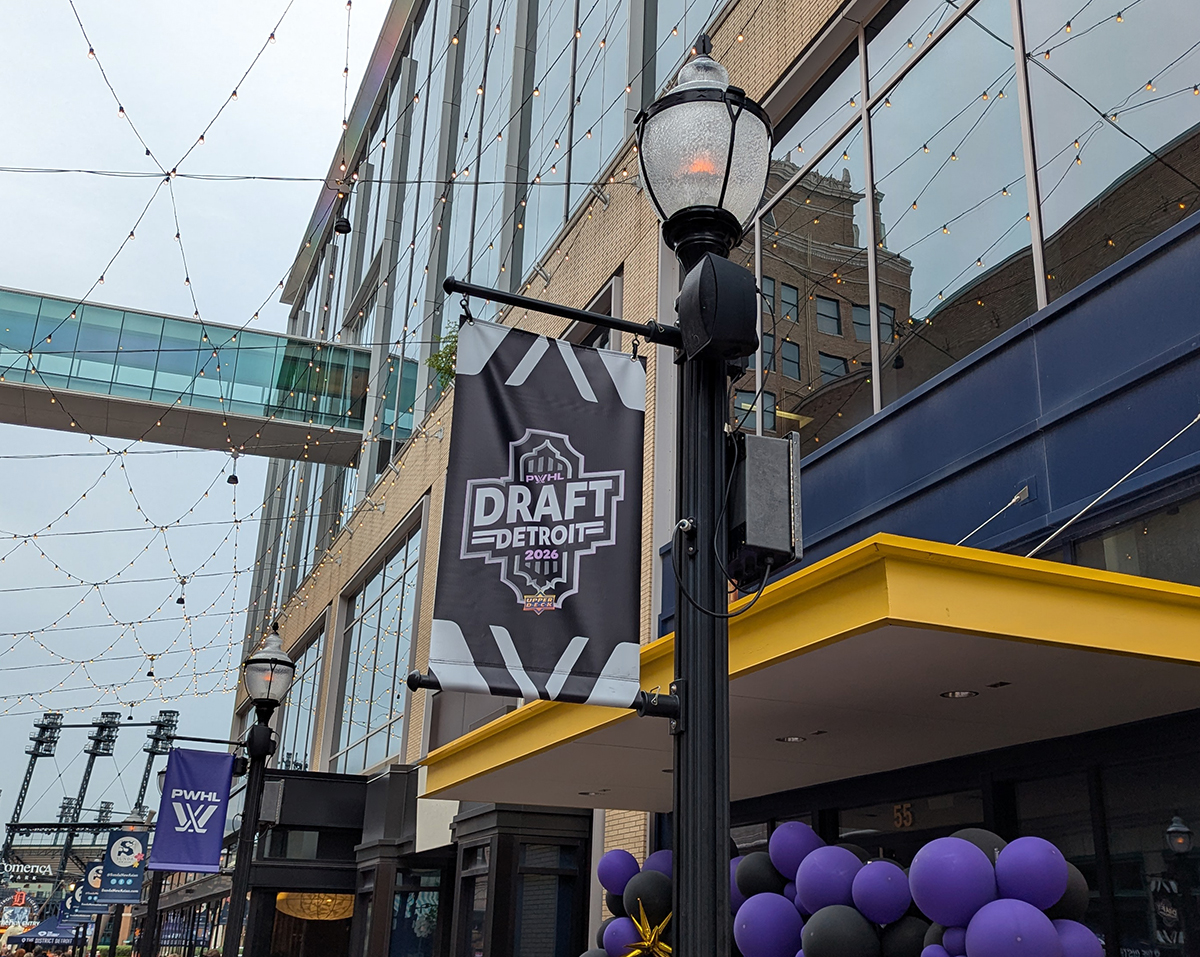 A banner celebrating the 2026 PWHL Entry Draft hangs on Columbia Street next to the Fox Theater.