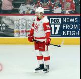 Eduards Tralmaks of the Grand Rapids Griffins skates near the boards during pre-game warmups before a game against the Manitoba Moose.