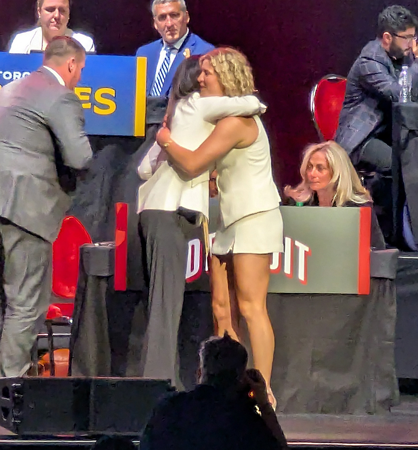 PWHL Detroit general manager Manon Rheaume hugs Casey Borgiel after making Borgiel the team's second pick at the 2026 PWHL Entry Draft.