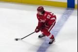 Moritz Seider of the Detroit Red Wings skates at the blue line during a game against the Carolina Hurricanes.
