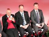 Darren McCarty, Kirk Maltby, and Kris Draper watch Sergei Fedorov speak during Fedorov's jersey retirement ceremony.