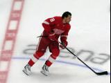 Ben Chiarot of the Detroit Red Wings skates at center ice during pre-game warmups before a game against the Carolina Hurricanes, wearing a customized Sergei Fedorov jersey and white skates in honor of Fedorov's jersey retirement.