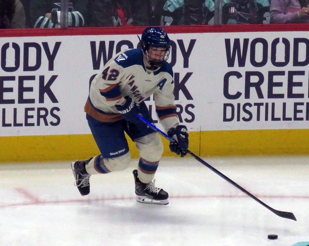 Claire Thompson of the Vancouver Goldeneyes carries the puck during the PWHL Takeover Tour Detroit game against the Boston Fleet.