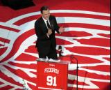 Sergei Fedorov claps with the crowd before speaking at his jersey retirement ceremony.