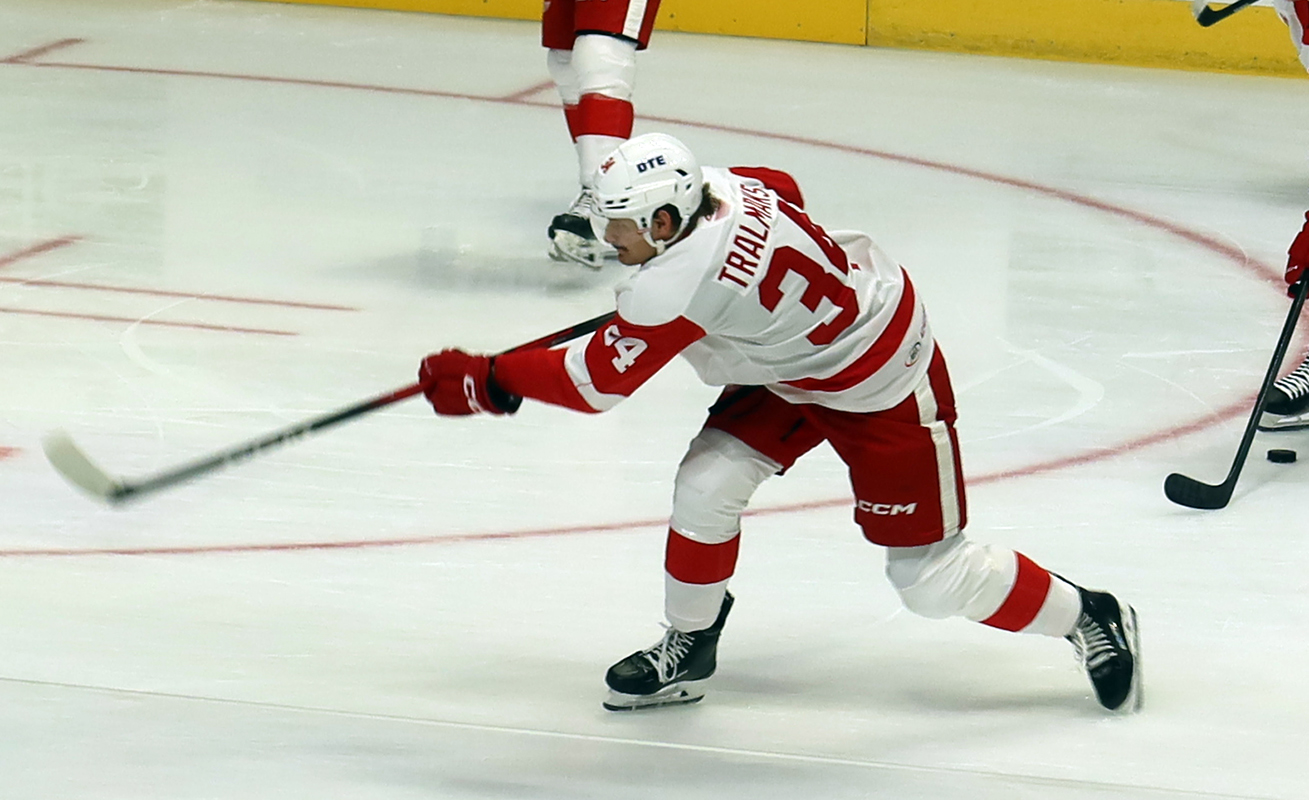 Eduards Tralmaks of the Grand Rapids Griffins fires a shot on goal during pre-game warmups before a game against the Manitoba Moose.