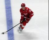 Jacob Bernard-Docker of the Detroit Red Wings skates across the blue line during pre-game warmups before a game against the Carolina Hurricanes, wearing a customized Sergei Fedorov jersey and white skates in honor of Fedorov's jersey retirement.