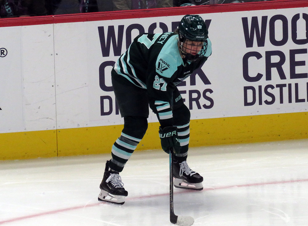 Shay Maloney of the Boston Fleet lines up for a faceoff during the PWHL Takeover Tour Detroit game against the Vancouver Goldeneyes.