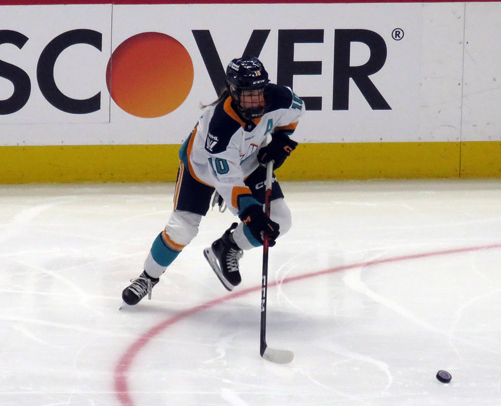 Sarah Fillier of the New York Sirens plays the puck during the PWHL Takeover Tour Detroit game against the Montreal Victoire.