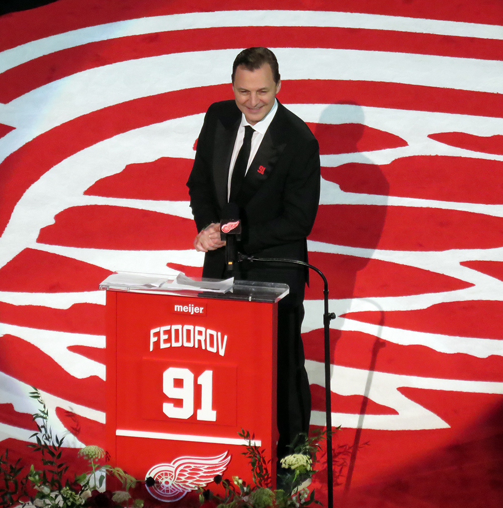 Sergei Fedorov stands at the podium during his jersey retirement ceremony.