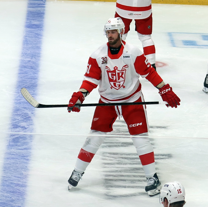 Austin Watson of the Grand Rapids Griffins skates at the blue line during pre-game warmups before a game against the Manitoba Moose.
