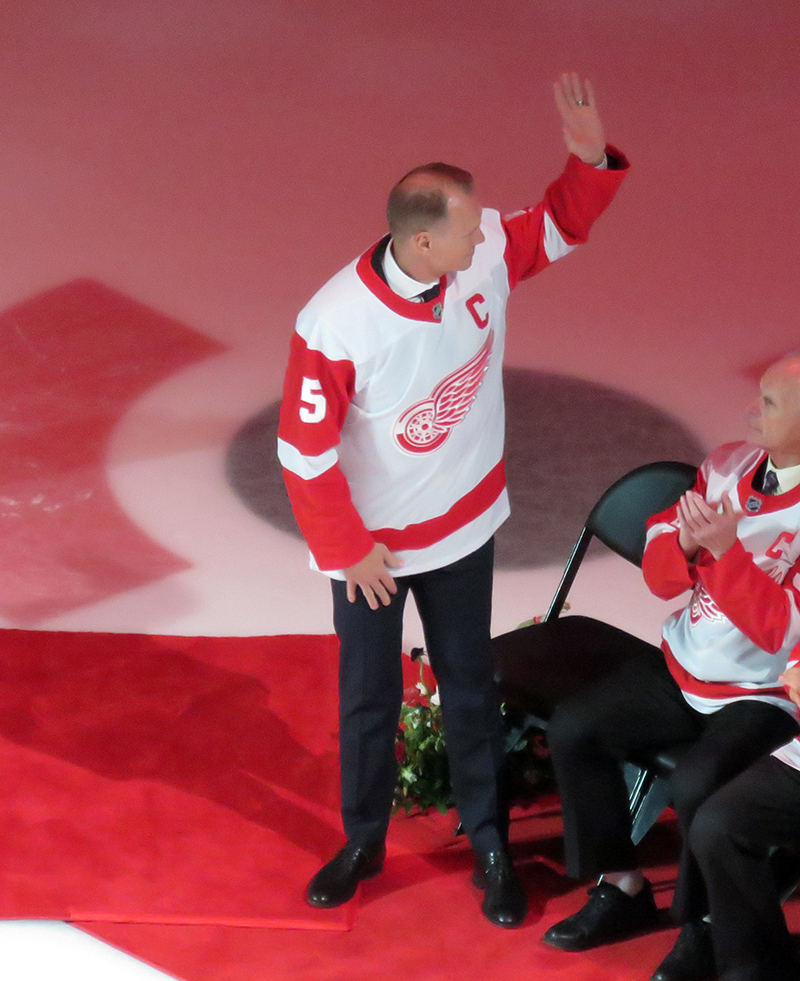 Nicklas Lidstrom waves to the crowd upon being introduced at Sergei Fedorov's jersey retirement ceremony.