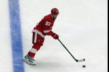 Alex DeBrincat of the Detroit Red Wings skates during pre-game warmups before a game against the Carolina Hurricanes, wearing a customized Sergei Fedorov jersey and white skates in honor of Fedorov's jersey retirement.