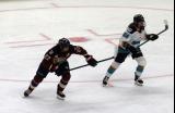 Shiann Darkangelo of the Montreal Victoire and Casey O'Brien of the New York Sirens skate up ice the PWHL Takeover Tour Detroit game.