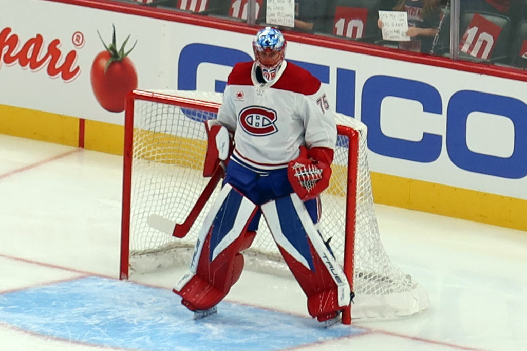 Jakub Dobes of the Montreal Canadiens stands in his crease during pre-game warmups before a game against the Detroit Red Wings.