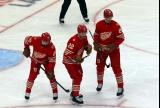 Albert Johansson, Mason Appleton, and Elmer Soderblom of the Detroit Red Wings get set for a faceoff during a game against the Montreal Canadiens.