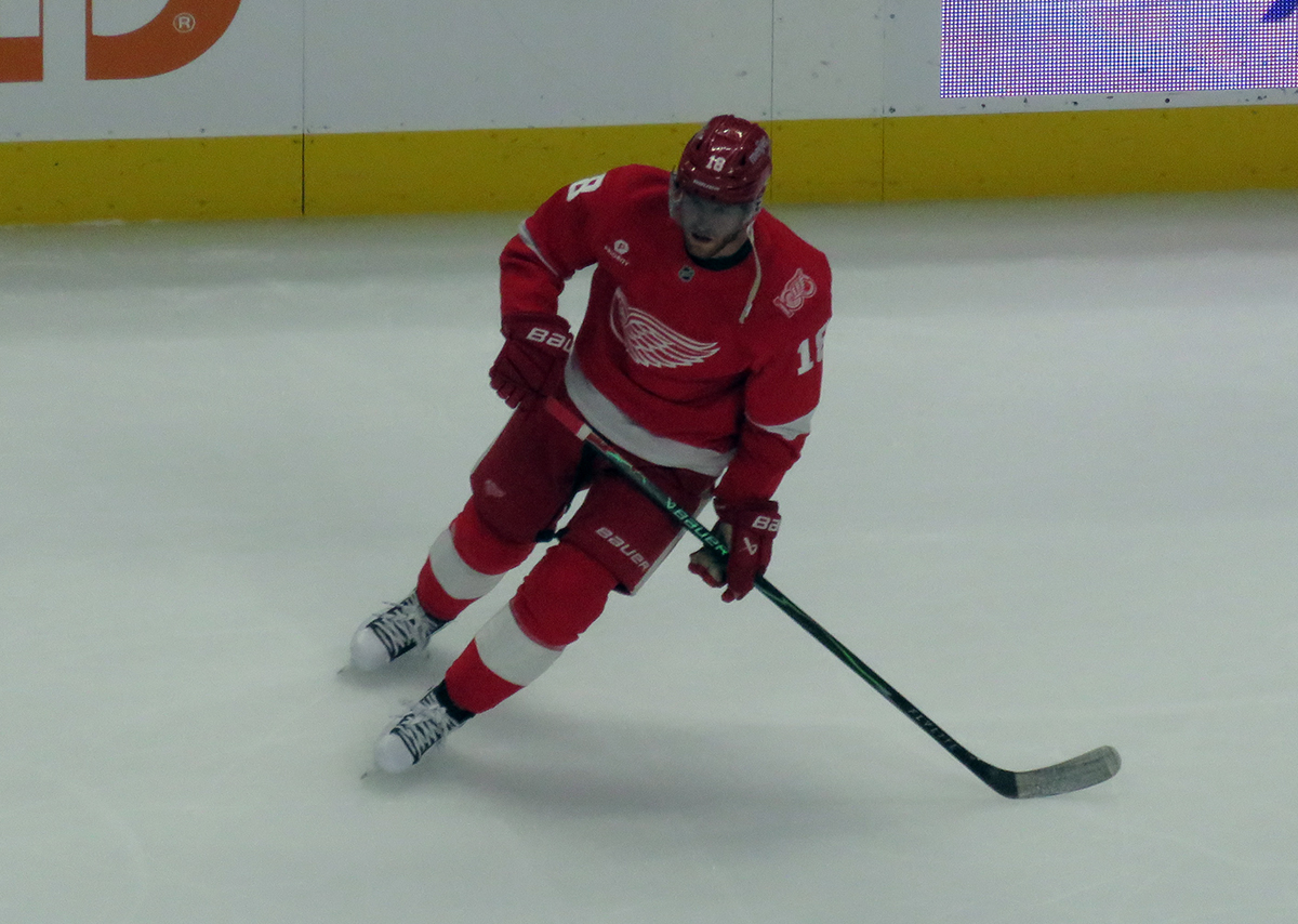 Andrew Copp of the Detroit Red Wings skates during pre-game warmups before a game against the Carolina Hurricanes, wearing a customized Sergei Fedorov jersey and white skates in honor of Fedorov's jersey retirement.