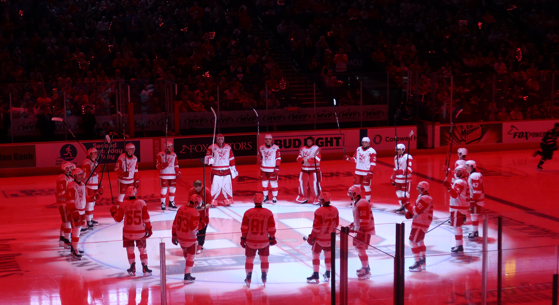The Grand Rapids Griffins salute their fans from center ice at the end of player introductions before the team's home opener against the Manitoba Moose.