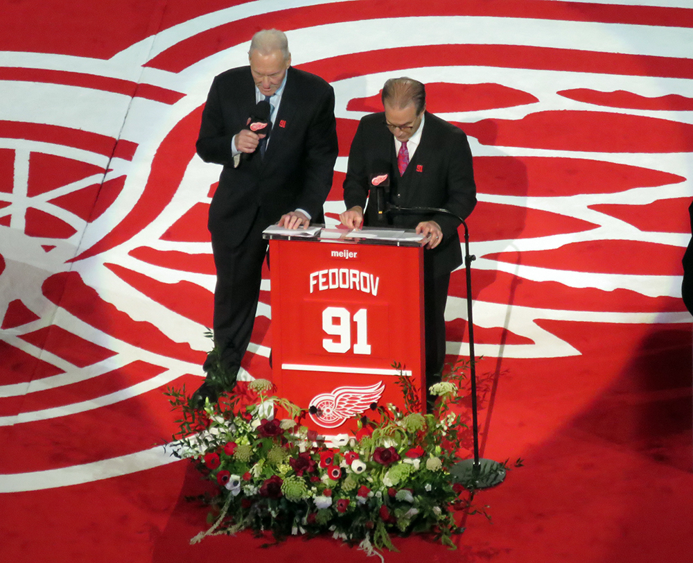 Red Wings television commentators Mickey Redmond and Ken Daniels speak at Sergei Fedorov's jersey retirement ceremony.