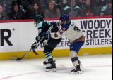 Shay Maloney of the Boston Fleet and Hannah Miller of the Vancouver Goldeneyes fight for position near the boards during the PWHL Takeover Tour Detroit game.